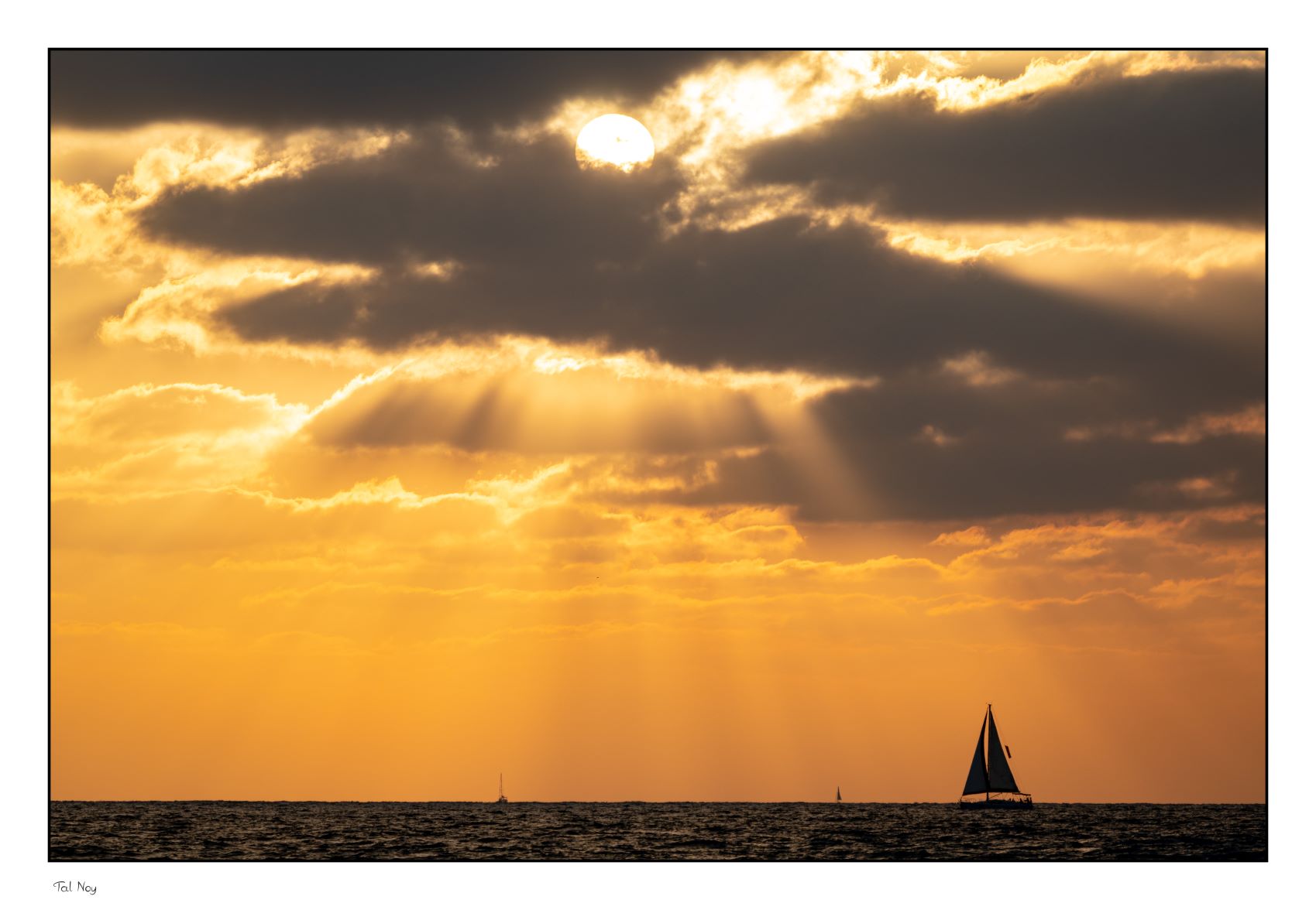Sailing - sailboat gliding across crystal clear waters